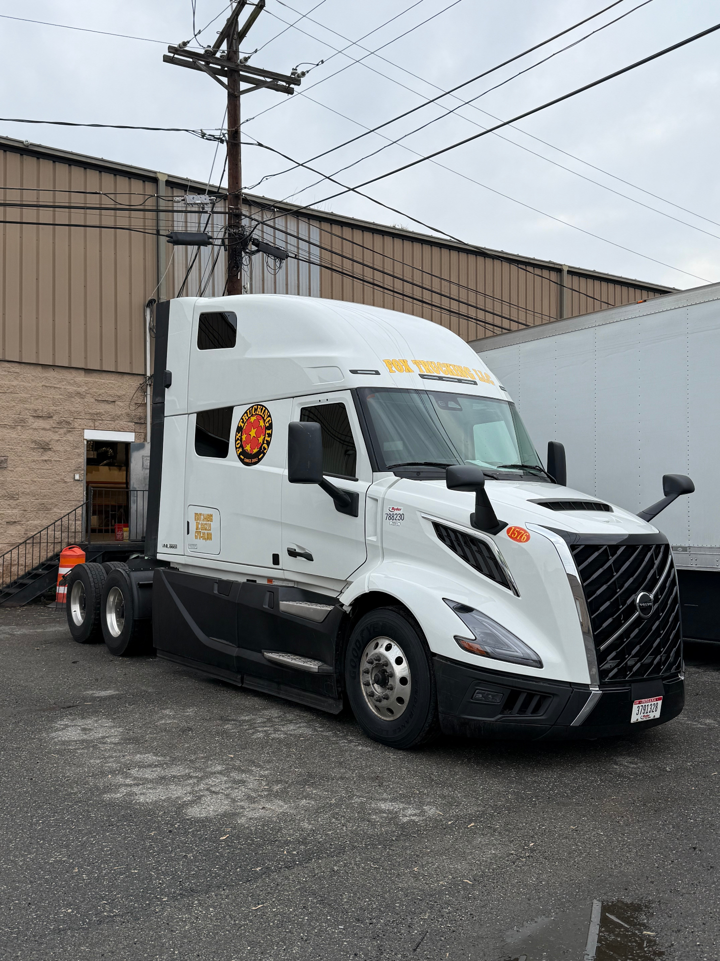 Fox Trucking blue Volvo with reefer trailer